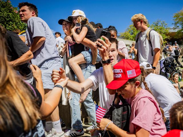 The crowd reacts after Charlie Kirk, the CEO and co-founder of the conservative youth organization Turning Point USA, is shot at the Utah Valley University Wednesday, Sept. 10, 2025, in Orem, Utah. (Tess Crowley/The Deseret News via AP)