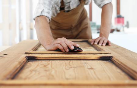 A carpenter working with wood