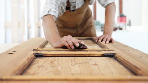 A carpenter working with wood
