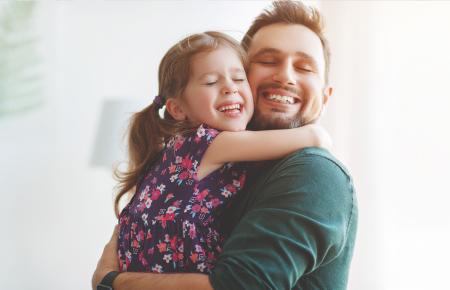 dad and daughter hug