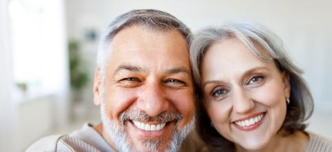 Senior couple smiling legacy giving