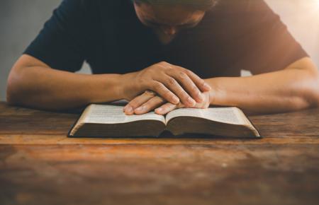 Man reading a Bible