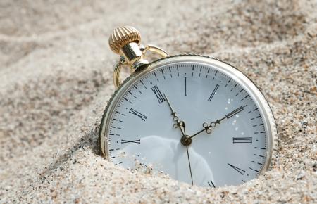 Pocket watch in the sand