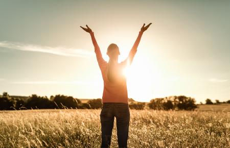 lifting hands to the sun