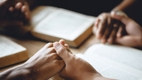 people-bibles-hold-hands-1200.png