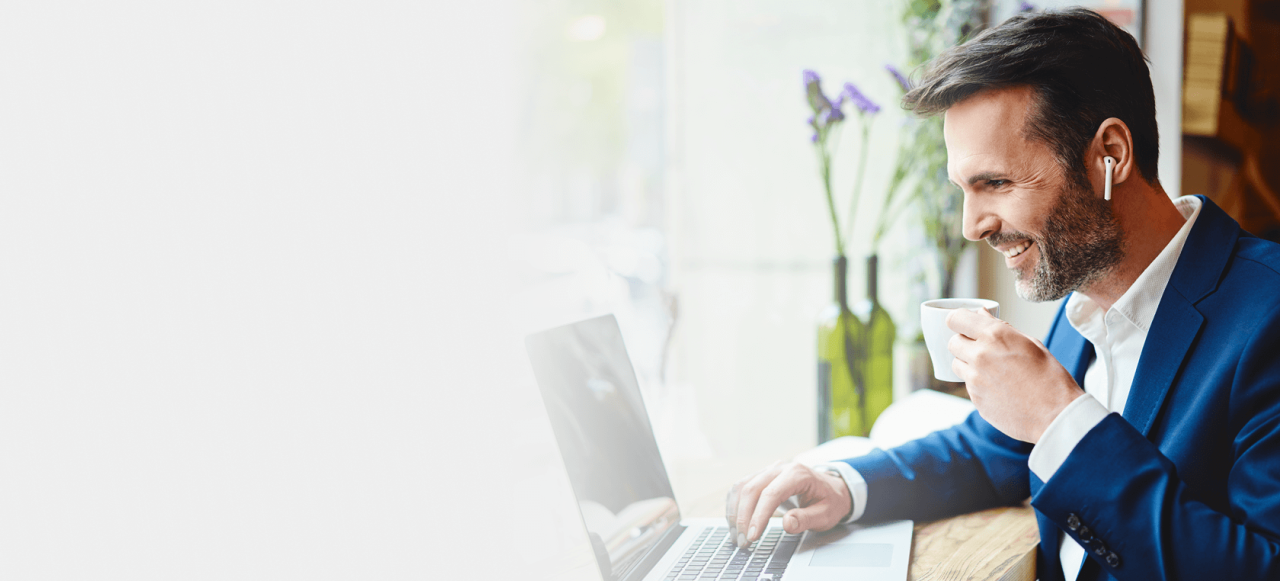 Man Listening on Laptop