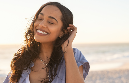 woman-smiling-seashore-1200.png
